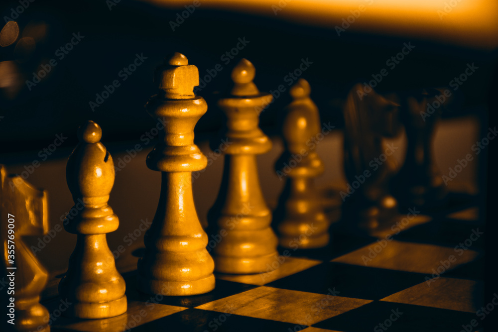 strategically playing chess with enemy player closeup king and queen figures strategically playing chess with enemy player closeup king and queen figures