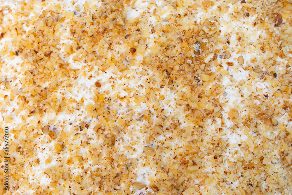 walnuts and cream cake background, close-up view walnuts and cream cake background, close-up view