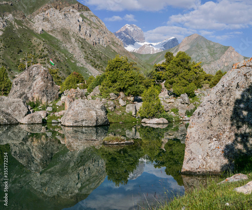 Tourism in Tajikistan, lake in the Fan Mountains, scenic summer view. Travels in Central Asia.