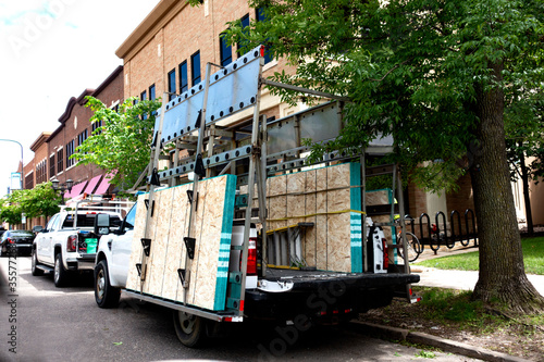 ST PAUL, MINNESOTA / USA - MAY 29, 2020: Truck containing boards to cover store windows against possible rioting due to the police killing by. photo