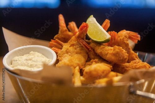 fried shrimp with sauce and lemon slice