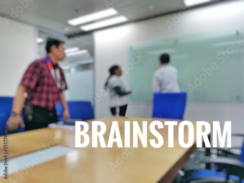 Wording brainstorm with blurred background of group discussion 