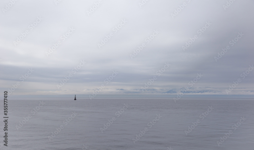 Rainy day at the Ogden Point breakwater district. A lone light feature stands 