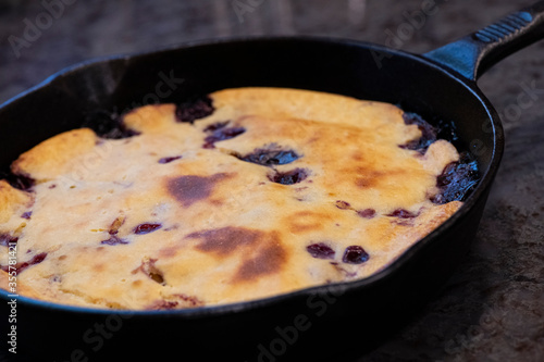 Cast iron skillet blueberry pancakes made from sourdough batter.