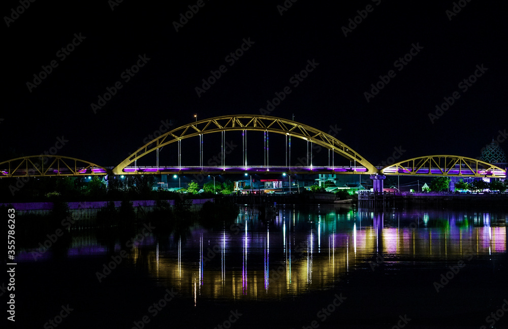 Fototapeta premium Bridge luminescent purple, Tanah Grogot Indonesia