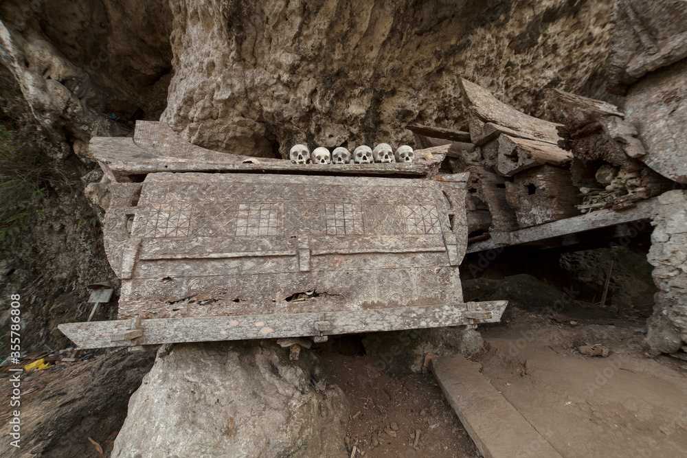 Torajan cliff burial, carved coffin Torajan cliff burial, carved coffin