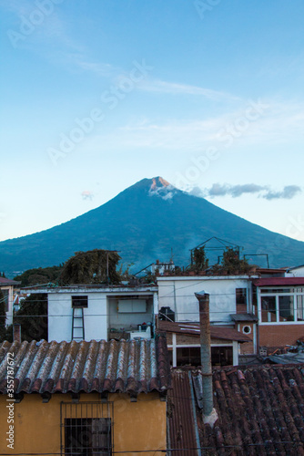 city ​​landscape with the background of a volcano
