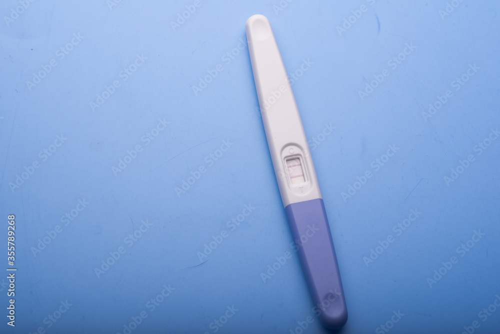 A pregnancy test kit isolated over various background A pregnancy test kit isolated over various background