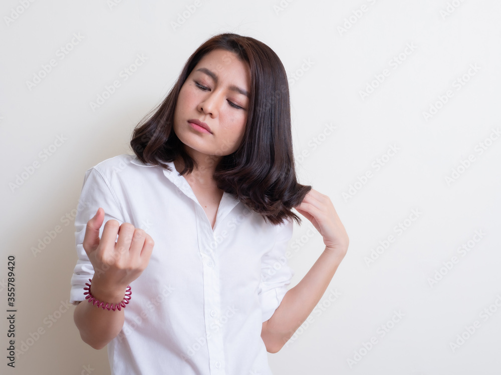 Portrait of young asian woman standing and smiling