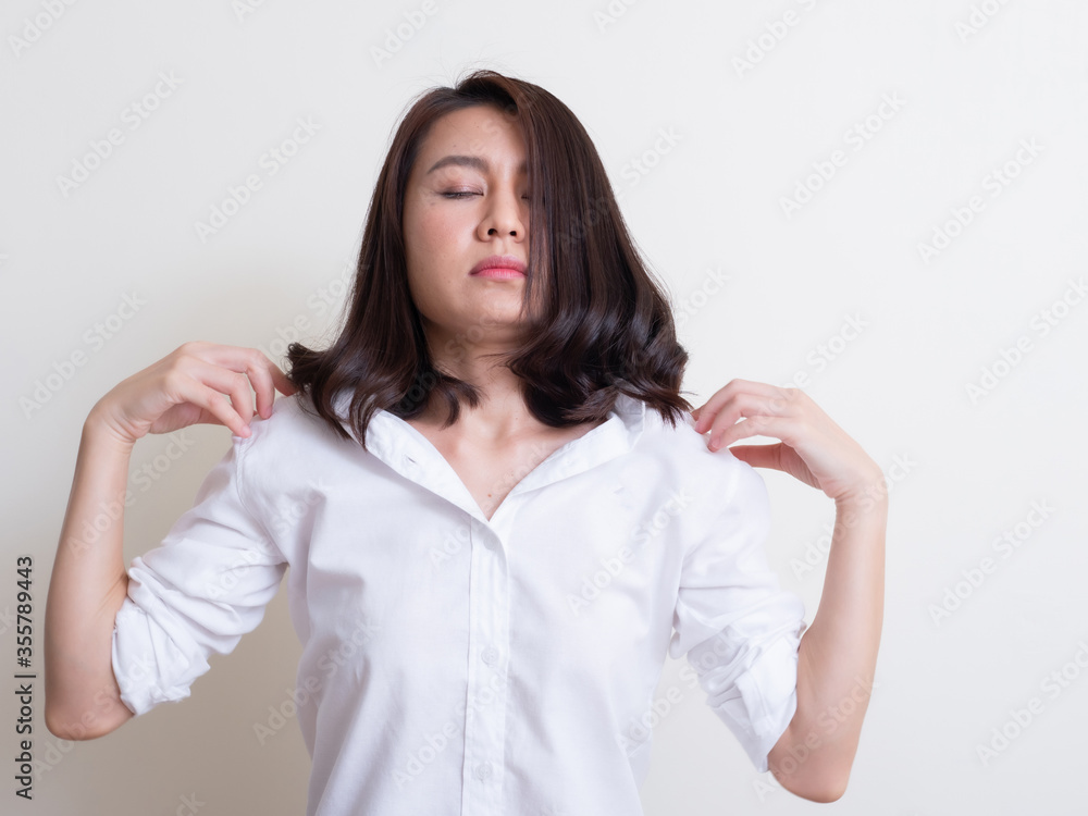 Portrait of young asian woman standing and smiling Portrait of young asian woman standing and smiling