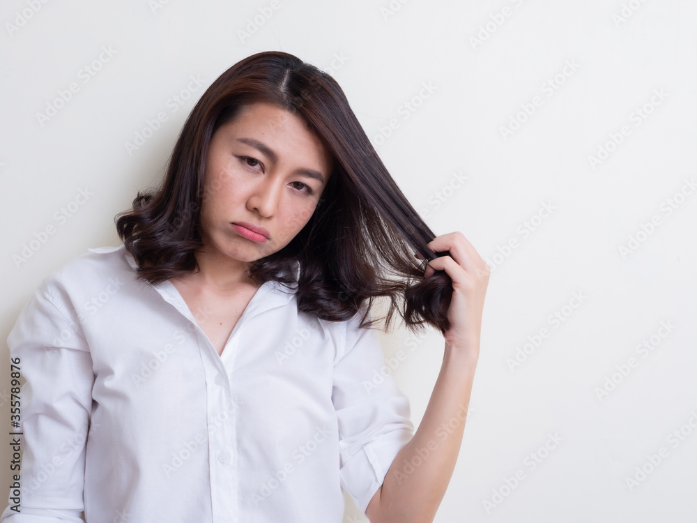Portrait of young asian woman standing and smiling Portrait of young asian woman standing and smiling