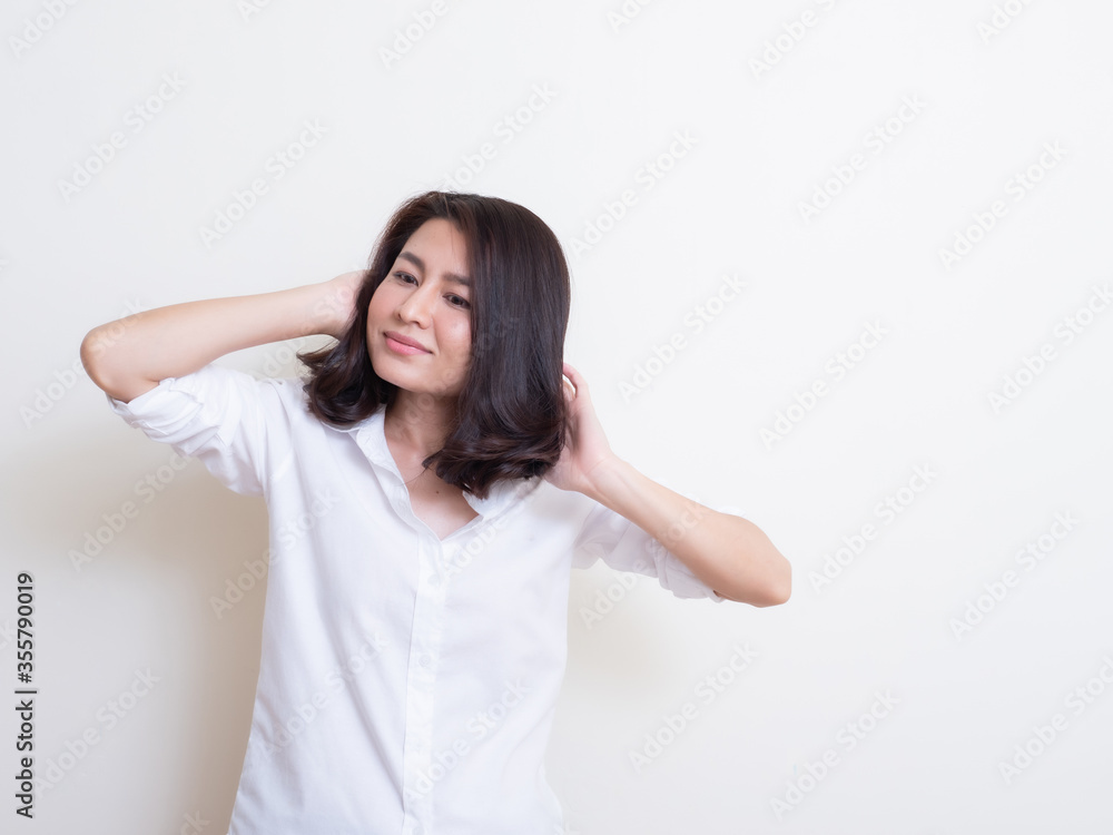 Portrait of young asian woman standing and smiling Portrait of young asian woman standing and smiling