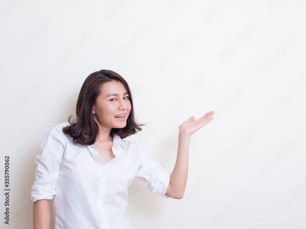 Portrait of young asian woman standing and smiling Portrait of young asian woman standing and smiling