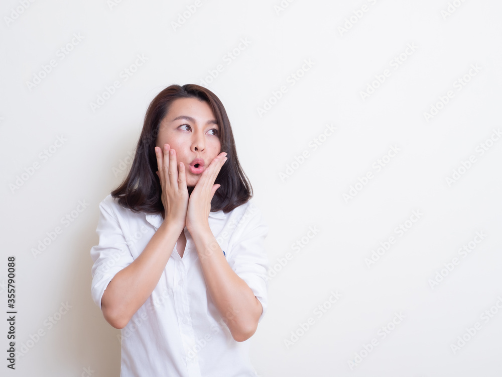 Portrait of young asian woman standing and smiling Portrait of young asian woman standing and smiling