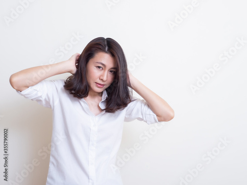 Portrait of young asian woman standing and smiling