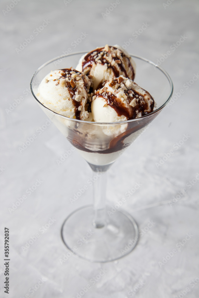 ice cream with chocolate syrup in an ice-cream bowl, selective focus ice cream with chocolate syrup in an ice-cream bowl, selective focus