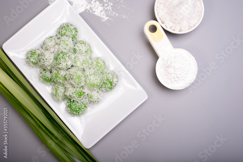 A set of traditional confectionery famous in Malaysia,Indonesia and Singapore,know as Buah Melaka or ondeh-ondeh ,isolated over grey,food photography concept 