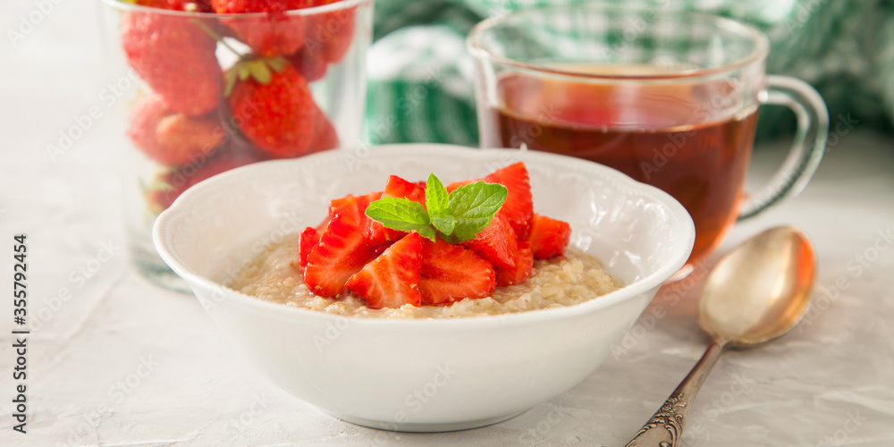 porridge with strawberry on a table, selective focus porridge with strawberry on a table, selective focus
