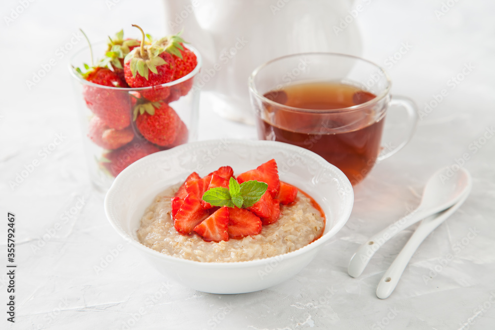 porridge with strawberry on a table, selective focus porridge with strawberry on a table, selective focus