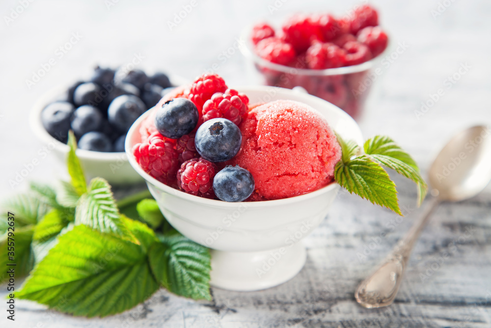 raspberry ice cream with berries, selective focus