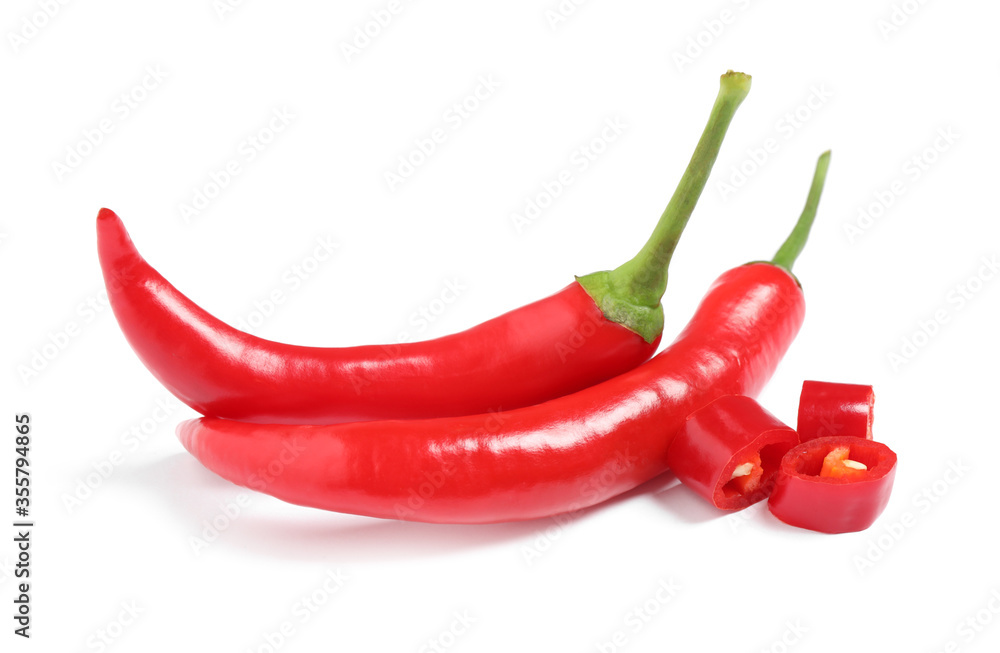Ripe red hot chili peppers isolated on white Ripe red hot chili peppers isolated on white