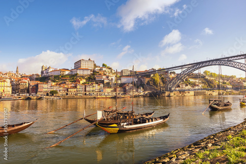 Porto Portugal city skyline at Porto Ribeira and Douro River with Rabelo wine boat
