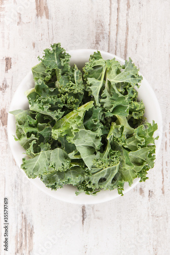 Fresh healthy green curly kale, diet, slimming and healthy eating concept