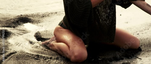 Warm sunrise on the black sand beach with sexy young woman girl posing very sexy and sensitive in swimwear and blouse middle angle slowmotion