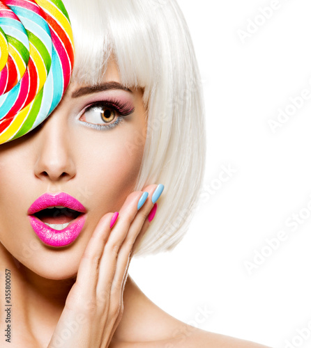 Surprised face of a pretty woman  with white hairs and multicolor nails