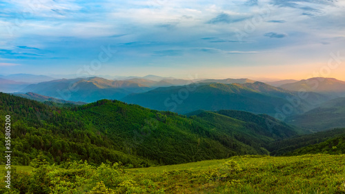 Picturesque mountains landscape with sunset. Summertime in Carpathians