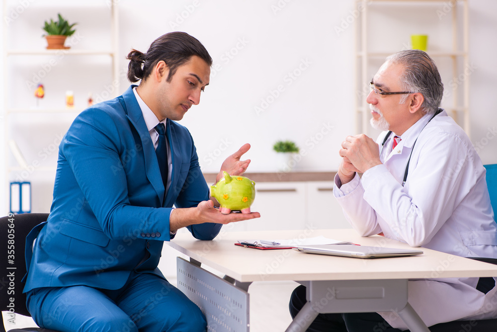 Young businessman meeting with old doctor Young businessman meeting with old doctor