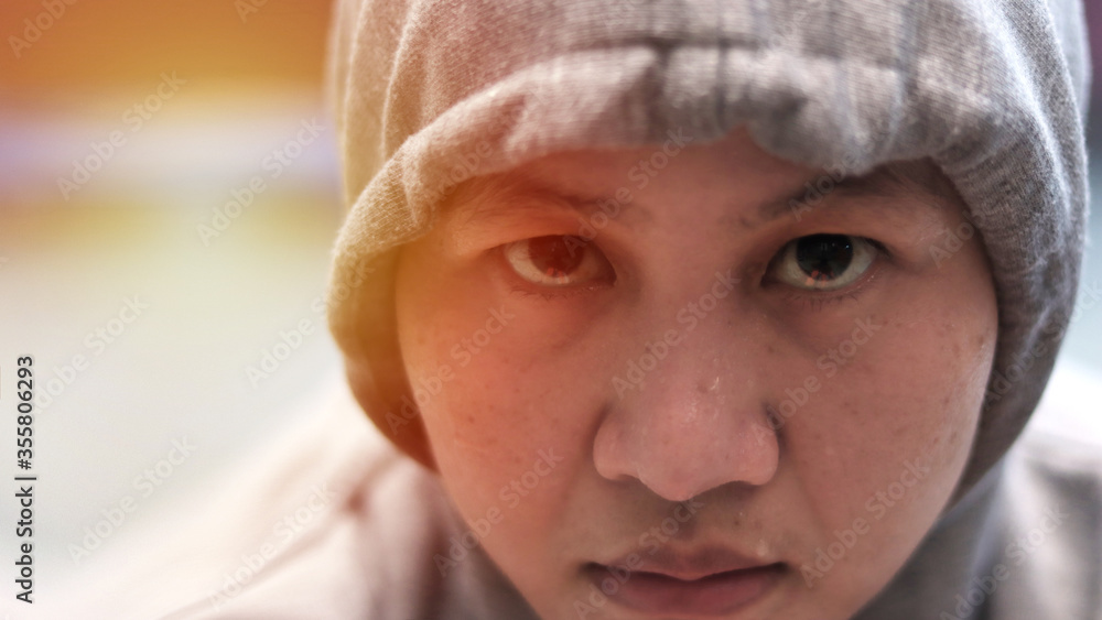 Close up portrait of Asian woman face when doing hard workout at home, intense look in her eyes with sweat on her face, tired female of doing cardio exercise Close up portrait of Asian woman face when doing hard workout at home, intense look in her eyes with sweat on her face, tired female of doing cardio exercise