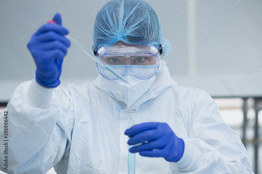 Scientist or researcher hand in blue gloves holding flu, measles, coronavirus, covid-19 vaccine disease preparing for human clinical trials vaccination shot, medicine and drug concept. Scientist or researcher hand in blue gloves holding flu, measles, coronavirus, covid-19 vaccine disease preparing for human clinical trials vaccination shot, medicine and drug concept.