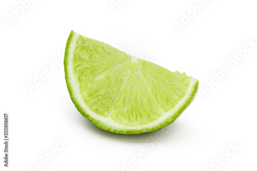 Lime slice into pieces on white background. Clipping path.