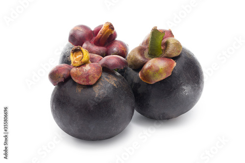 Ripe mangosteen isolated on white. Clipping path. Full depth.