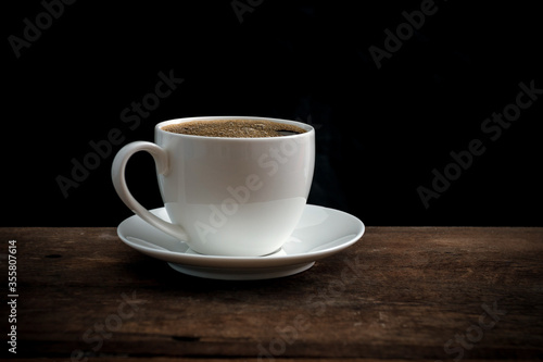 Cup of coffee on old wooden table