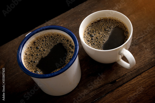 Cup of coffee on old wooden table