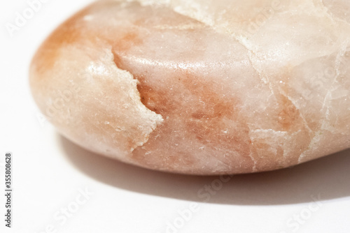 a pink marble against white background
