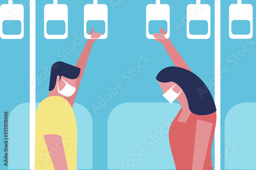 People travelling in a metro train wearing mask to prevent the viral disease spread.