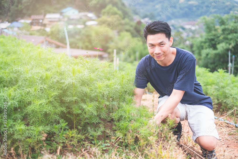 Portrait of Young asian man working in garden Portrait of Young asian man working in garden