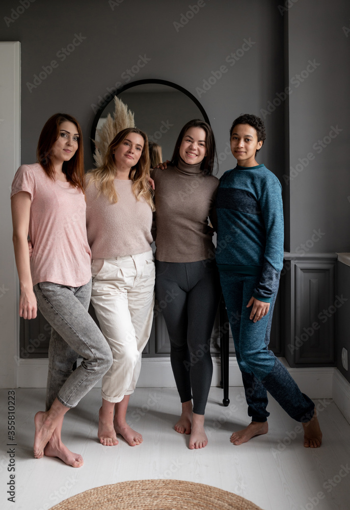 Group of young female friends hanging out at home. friendship, beauty, body positive and people concept