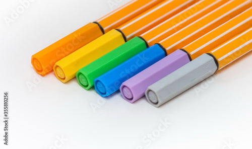 Set of colored markers on white background