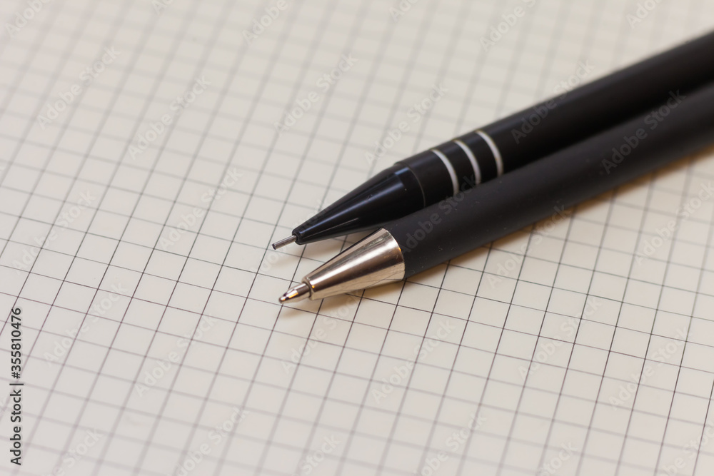 Black ballpoint pen and clutch pencil on paper Black ballpoint pen and clutch pencil on paper