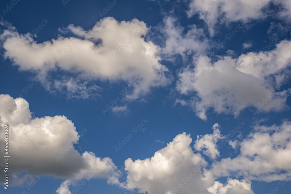 Obraz premium Blue sky background with big tiny stratus cirrus striped cloud