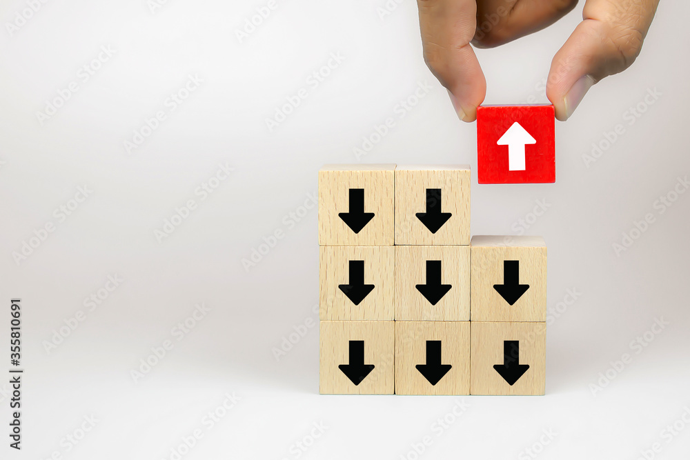 Businessman hand choose cube wooden toy blog with arrow icons concept of business for change leader to growth and success. Businessman hand choose cube wooden toy blog with arrow icons concept of business for change leader to growth and success.