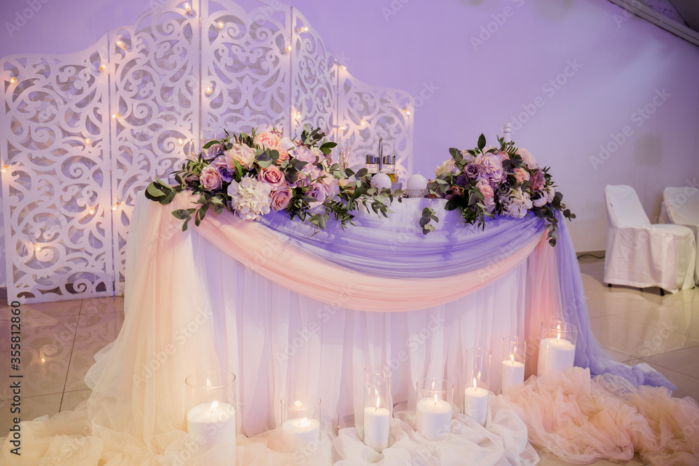 flower decor on a wedding table in a restaurant flower decor on a wedding table in a restaurant