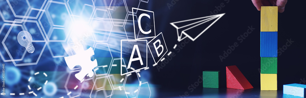 Naklejka premium Children's development. Children's wooden toy on the table in the play area. Room of children's creativity and self-development. Wooden constructor.