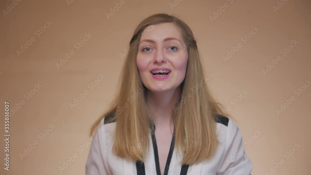 Girl sings badly singer front portrait learning to sing young woman with braces caucasian white 30 years old failed bad take Girl sings badly singer front portrait learning to sing young woman with braces caucasian white 30 years old failed bad take