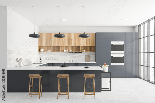 Gray and white kitchen interior with bar