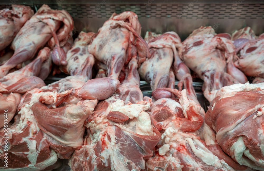 Raw lamb legs sold at a city supermarket